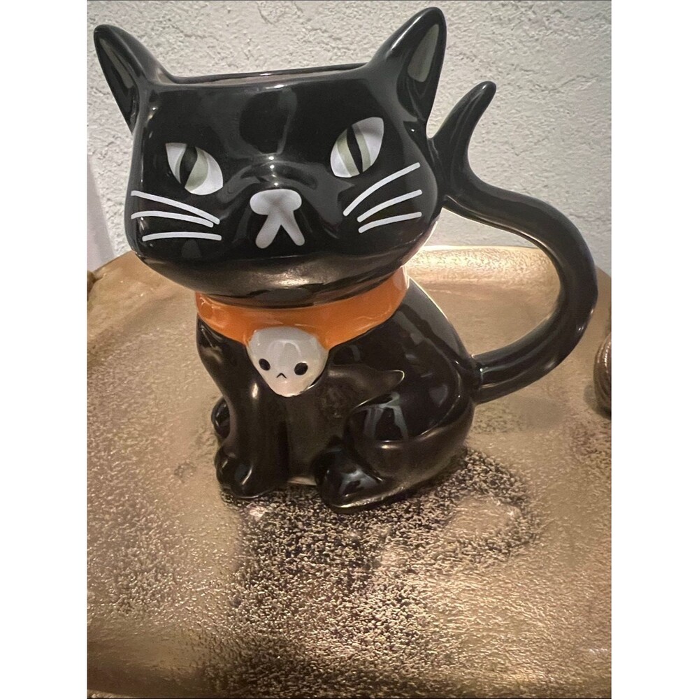 #2079**Black Ceramic Cat Mug with Orange Collar and Skull Charm